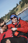 Our coxswain being carried in to the boat by the Women's Varsity coach..and that happens to be ME-L.jpg