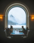 on a totally unrelated topic i found this photo as i am searching for leggings w a view with the following caption:<br />Views from a little coffee break yesterday at Lake Louise....the curious thing is that i did a couple of my windows with that same exact tombstone shaped arch and mahogany wood trim around and inside except i had by code (appx 5 foot wide) to put in a center mullion--BUT my views are of the street and backyard NOT that gorgeous scenery...LOL
