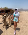 a tight shorts outfit and a camel together in the same picture; very very unusual but this gal visitd sharm el-sheikh in egypt during the corona virus pandemic&gt;&gt;&gt;&gt;&gt;LOL<br />women have to wear some sort of head veil as well in arabic countries....making for a very very unusual@interesting pic; for the locals over there to ask them their views to seeing this 'spectacle'<br />the head veil + mask + glasses; is she in a witness protection program???<br />except she stands out like a sore thumb over there.....HAHAHA